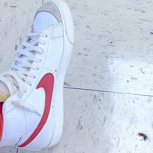 Orange and white Nike blazers